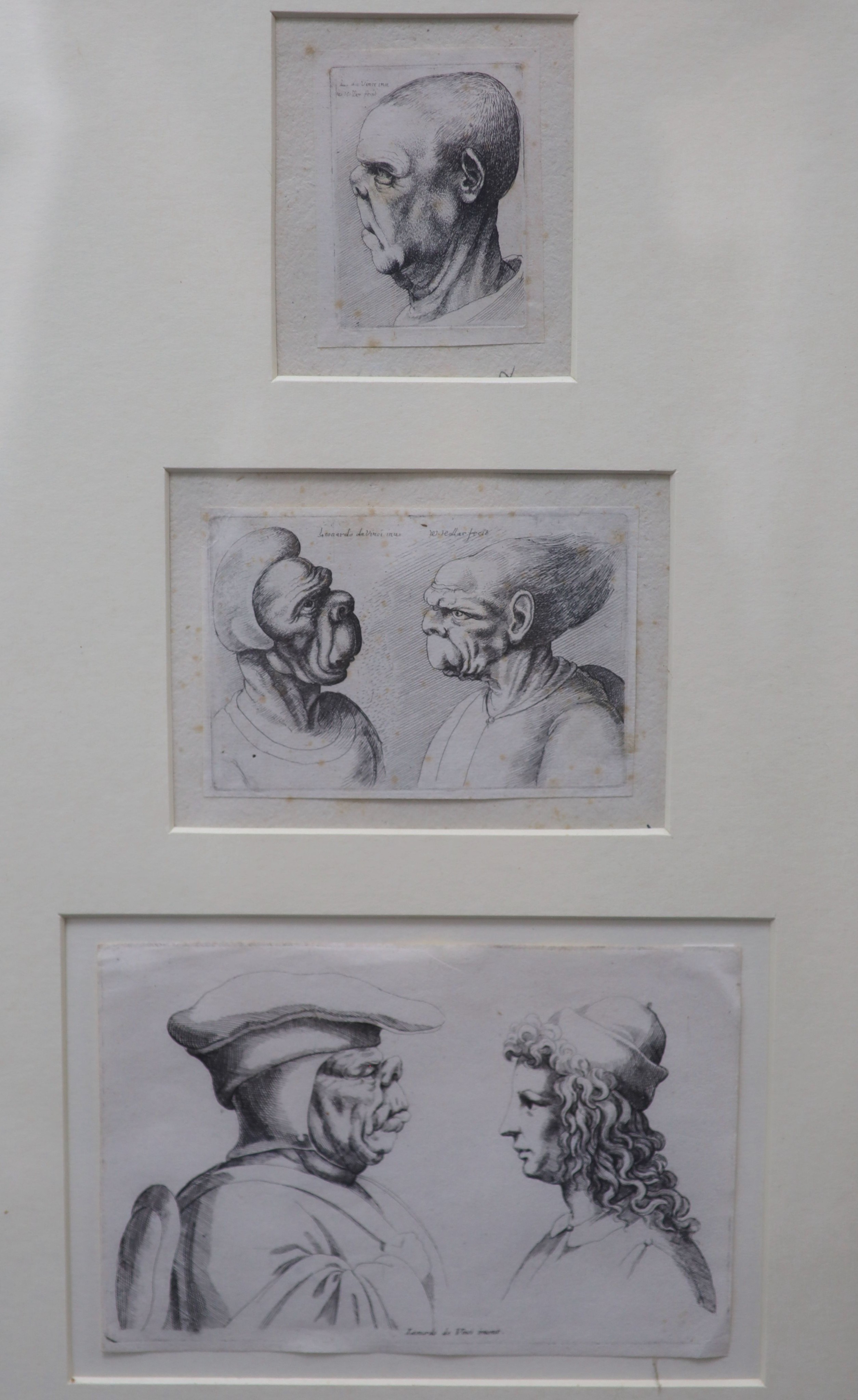 Wenceslaus Hollar after Leonardo da Vinci, a group of fourteen engravings of head studies in eight frames, all inscribed in the prints and a landscape, largest 12.5 x 8cm.